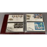 An album containing 121 Royal Mail First Day Covers,