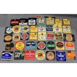 A collection of Tetley and other beer bottle labels