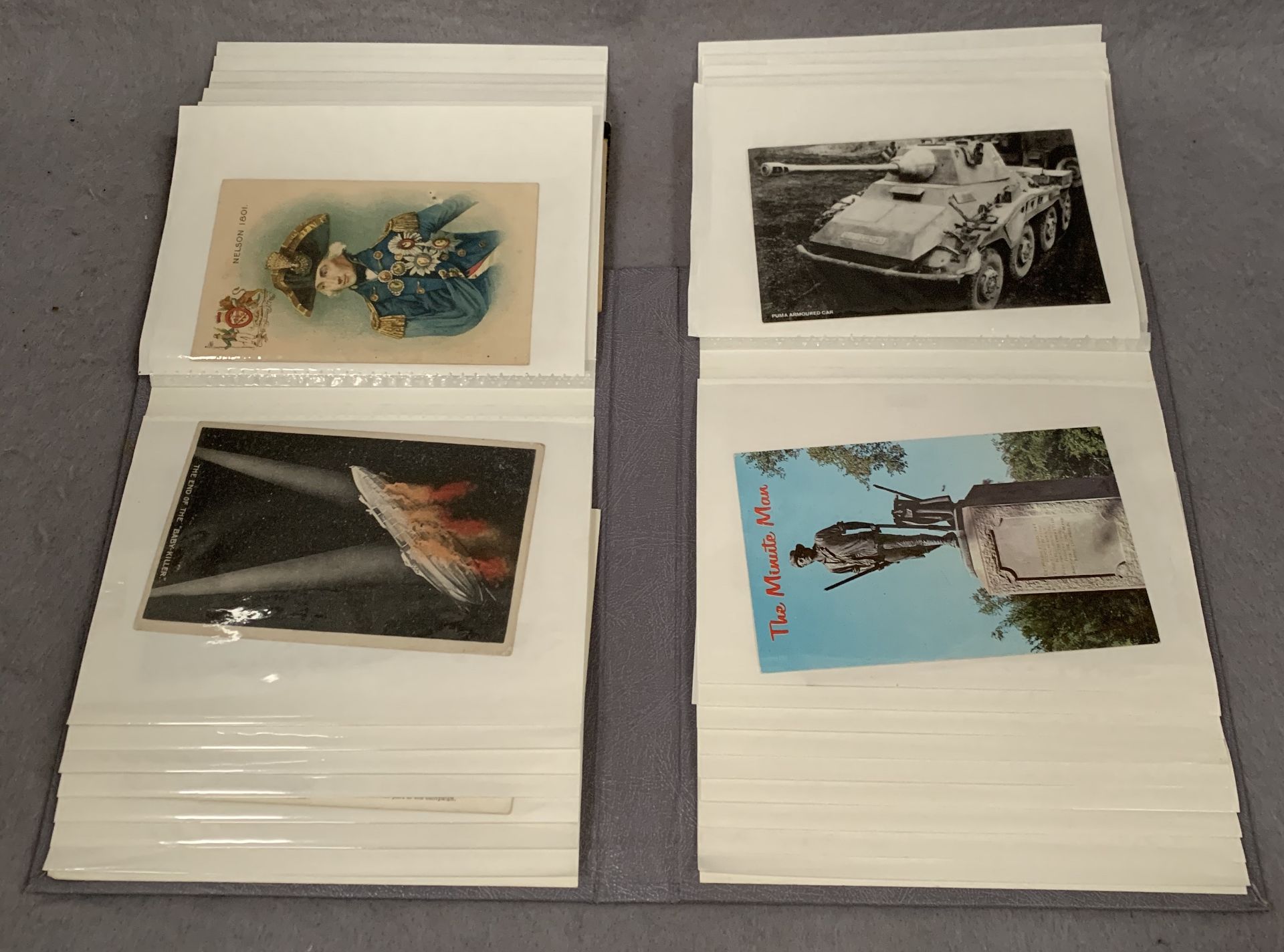 An album containing 49 assorted military postcards - 1st World War, modern etc.