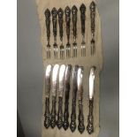 A twelve piece patterned EPNS knife and fork set and an extra knife (13)