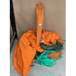An orange canvas tent with green vinyl groundsheet, poles and pegs (pre-owned), no fly sheet,