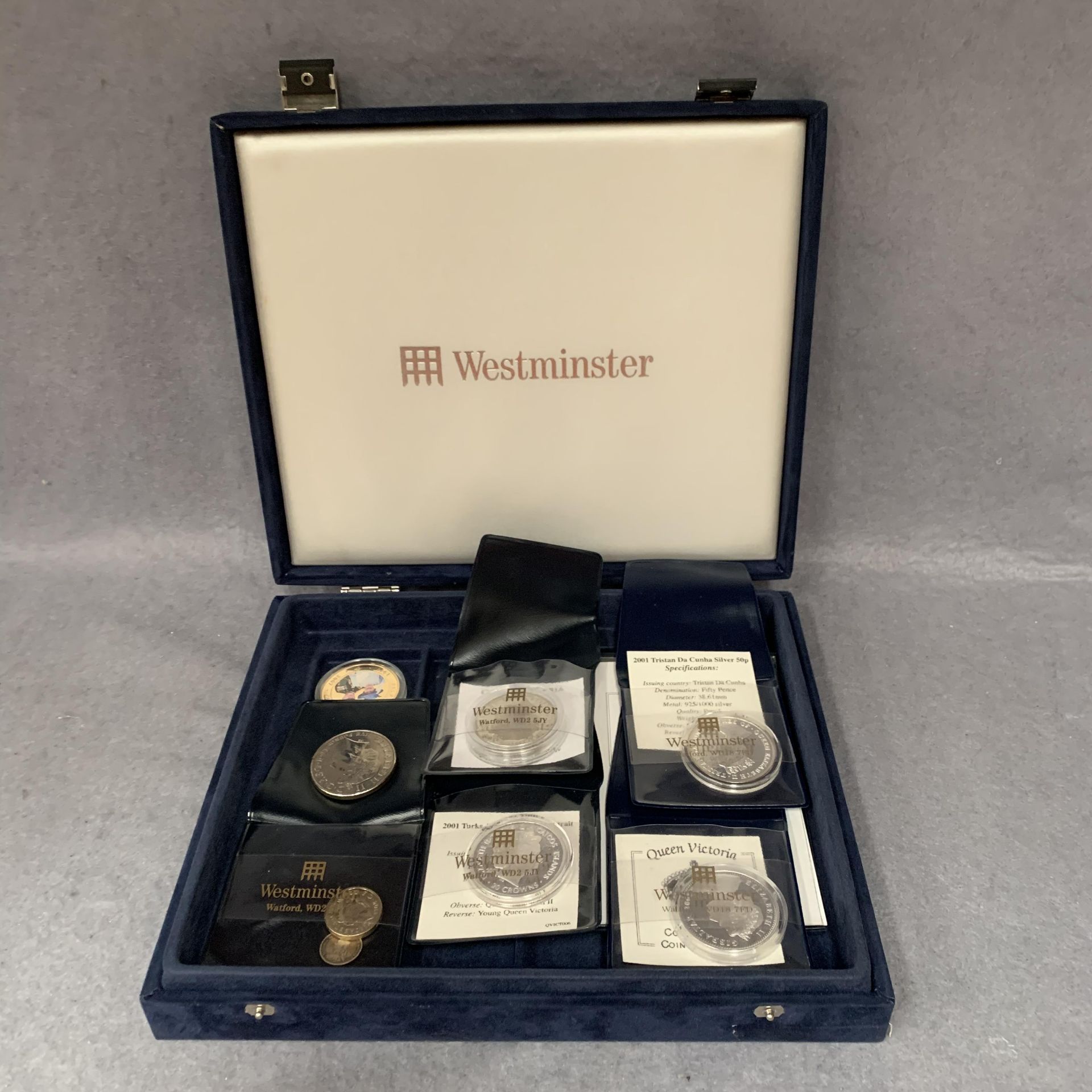 A Westminster Coin box and contents,