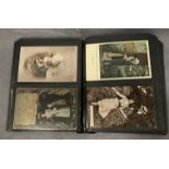 An album containing 180 assorted vintage 'Courting Couple' postcards