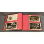 Album containing 160 vintage (1900s - 1930s) greetings postcards