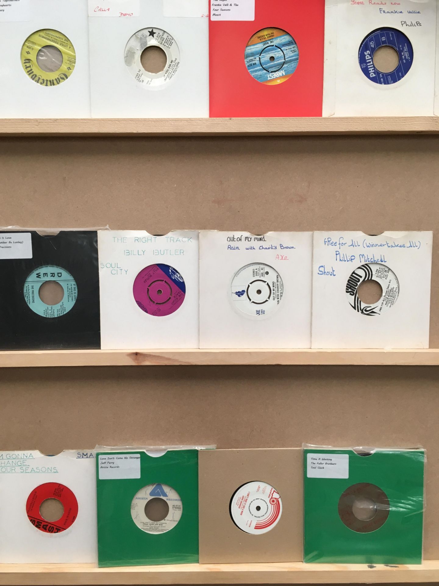 Twelve 45rpm singles, Rain with Charity Brown, Phillip Mitchell, Billy Butler, The Precisions,