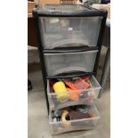 A black and clear plastic four tray modeller's storage unit,