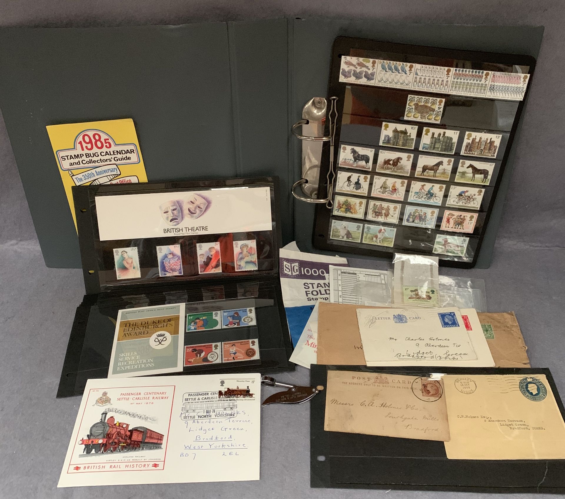 Contents to tray, Post Office and Royal Mail mint stamps, folder of GB stamps, stamped envelopes,