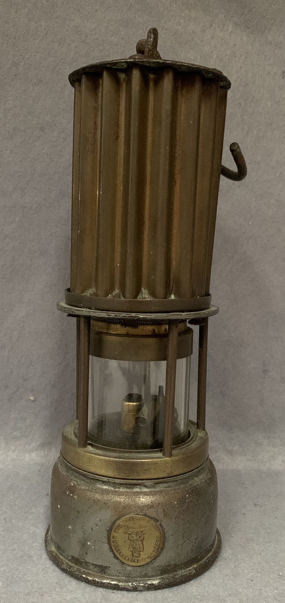 A brass and metal miner's lamp by The Premier Lamp Engineering Co.