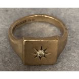 A 9ct gold signet ring set with a small diamond, approximate weight 7.