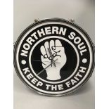 A Northern Soul 'Keep The Faith' wall clock ni the shape of a drum,