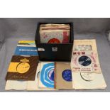 A black vinyl 45rpm singles, portable case and 40 45rpm singles,