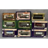 Nine boxed OO gauge goods wagons/rolling stock by Bachmann, Dapol, Replica, etc.