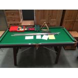 A Petworth House Classic Snooker Table, 185cm x 94cm on folding legs, complete with two cues,