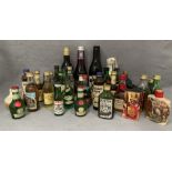 A collection of miniature spirits and liqueurs in 5cl bottles, small bottles of wine, etc.