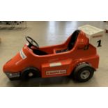 A Jolly Roger Racing children's fibre glass ex fairground ride car 53" long (requires battery and