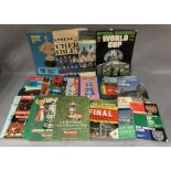 Approximately 45 football programmes,