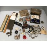 Contents to tray lighters, Dunhill cigarette box, slide ruler, costume jewellery,