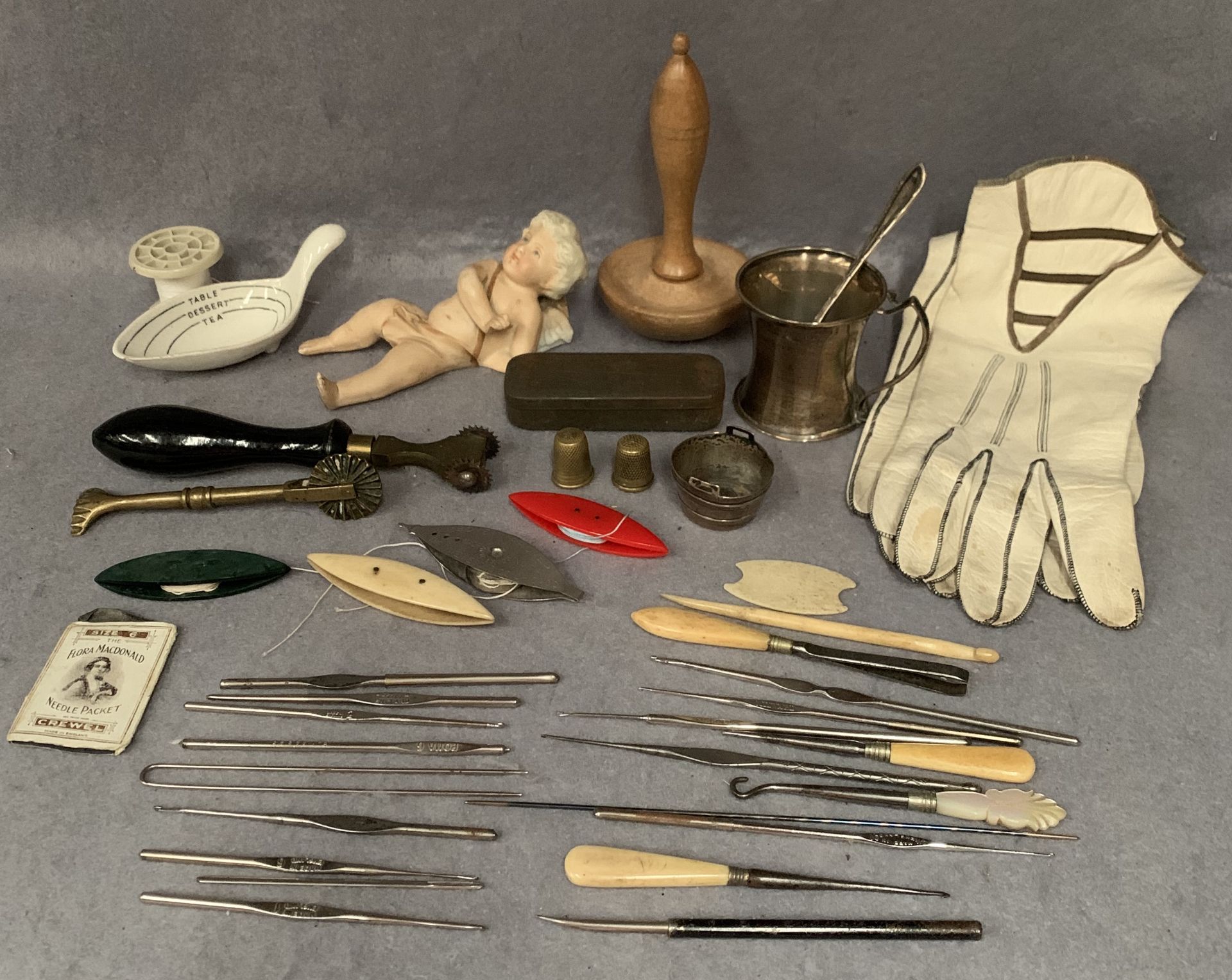 Contents to tray, a small silver tankard, pair of ladies gloves, small bisque figure (damaged),