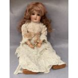 A bisque head doll marked PB SH 1909 7 1/2,