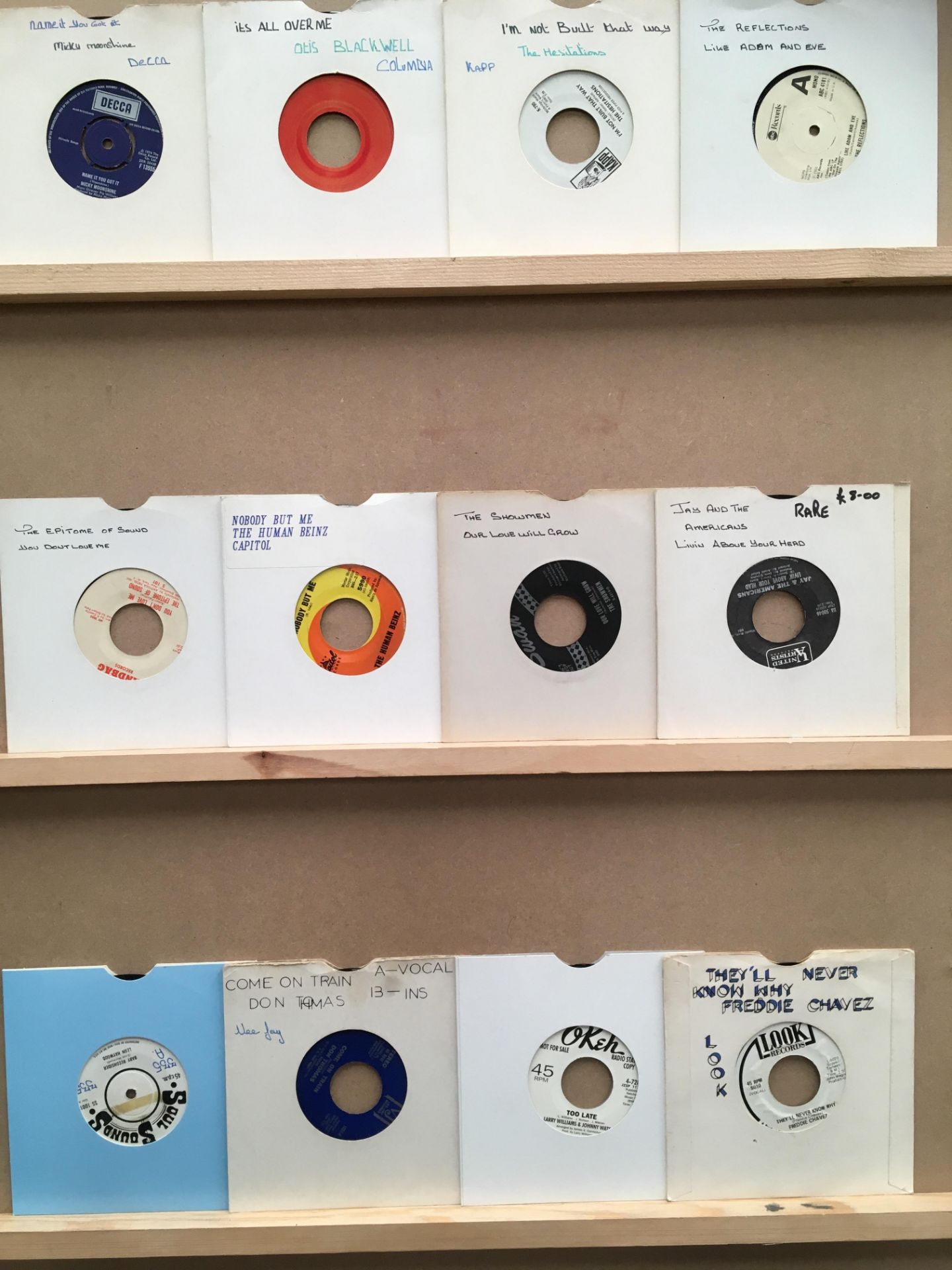 Twelve 45rpm singles, Micky Moonshine, Otis Blackwell, The Hesitations, The Reflections,