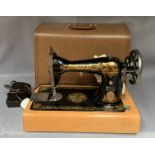 A Singer 240v portable sewing machine in case