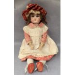 A bisque head doll marked Made in Germany C4,