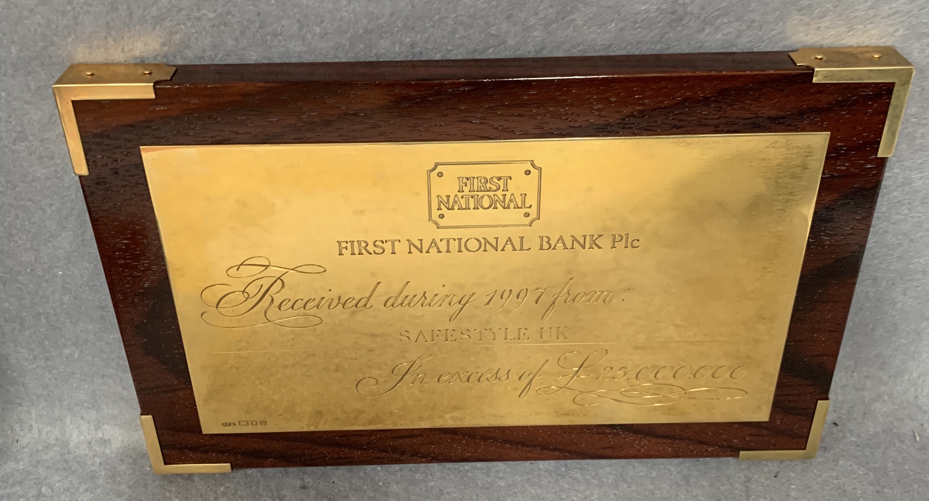 A silver presentation plaque from The First National Bank mounted on a walnut finish frame complete - Image 2 of 4