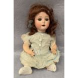 A bisque head doll marked B&O, B-3/0 Germany,