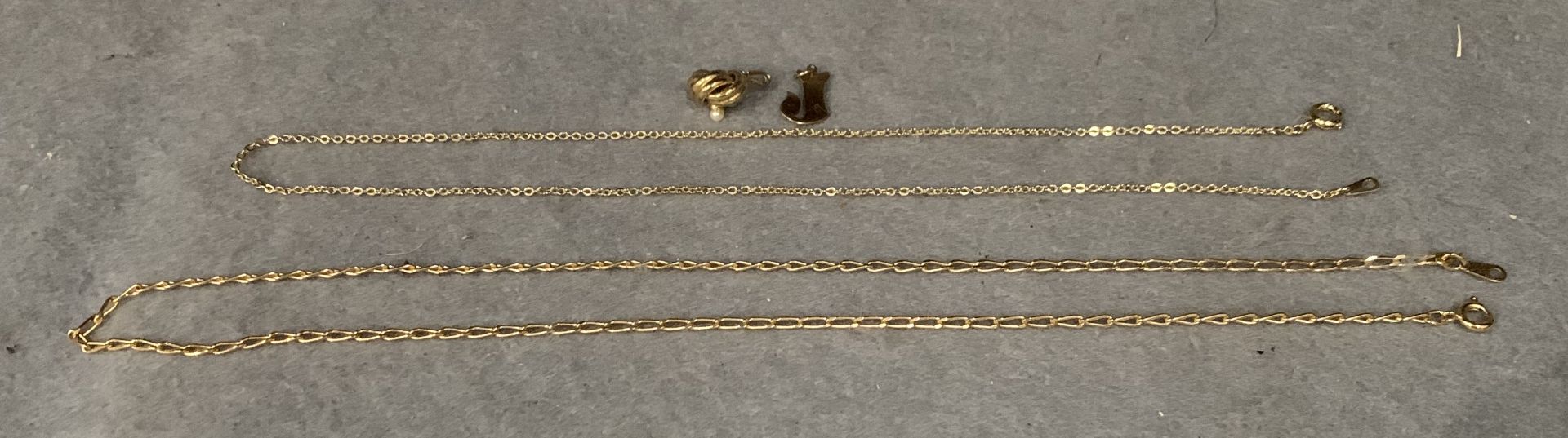 Two gold plated necklaces and two gold plated pendants,