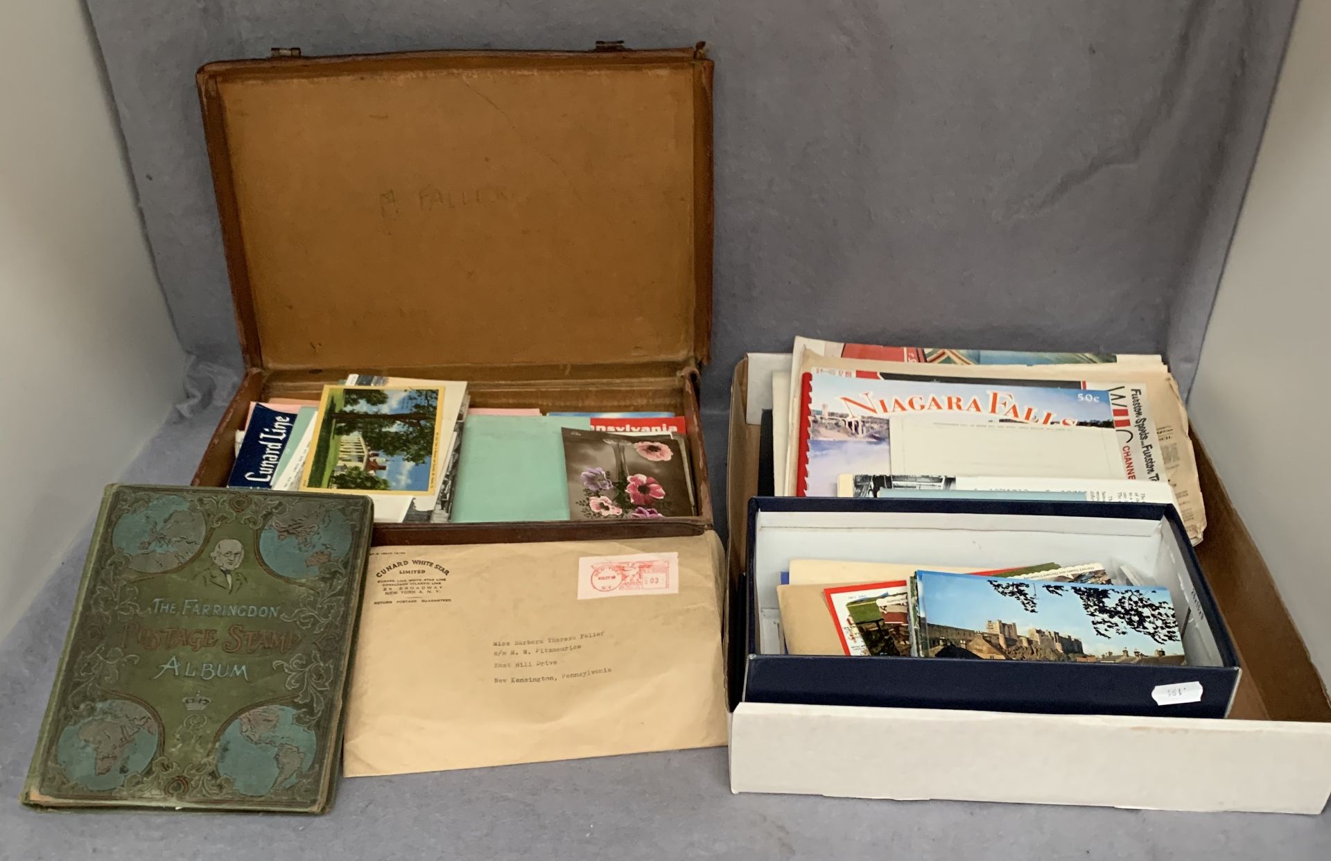 Contents to brown fibre suitcase and a box lid The Farringdon Postage Stamp album and contents -