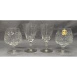 A pair of engraved wine glasses and a pair of lead cut crystal brandy glasses (4)