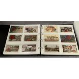 Album containing 300 vintage (1900s - 1930s) greetings postcards