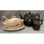 A black decorated pottery teapot and matching jug and a K & Co Oxford brown patterned tureen with