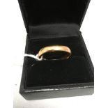 A 22ct gold wedding band (worn marks) - total weight 7.