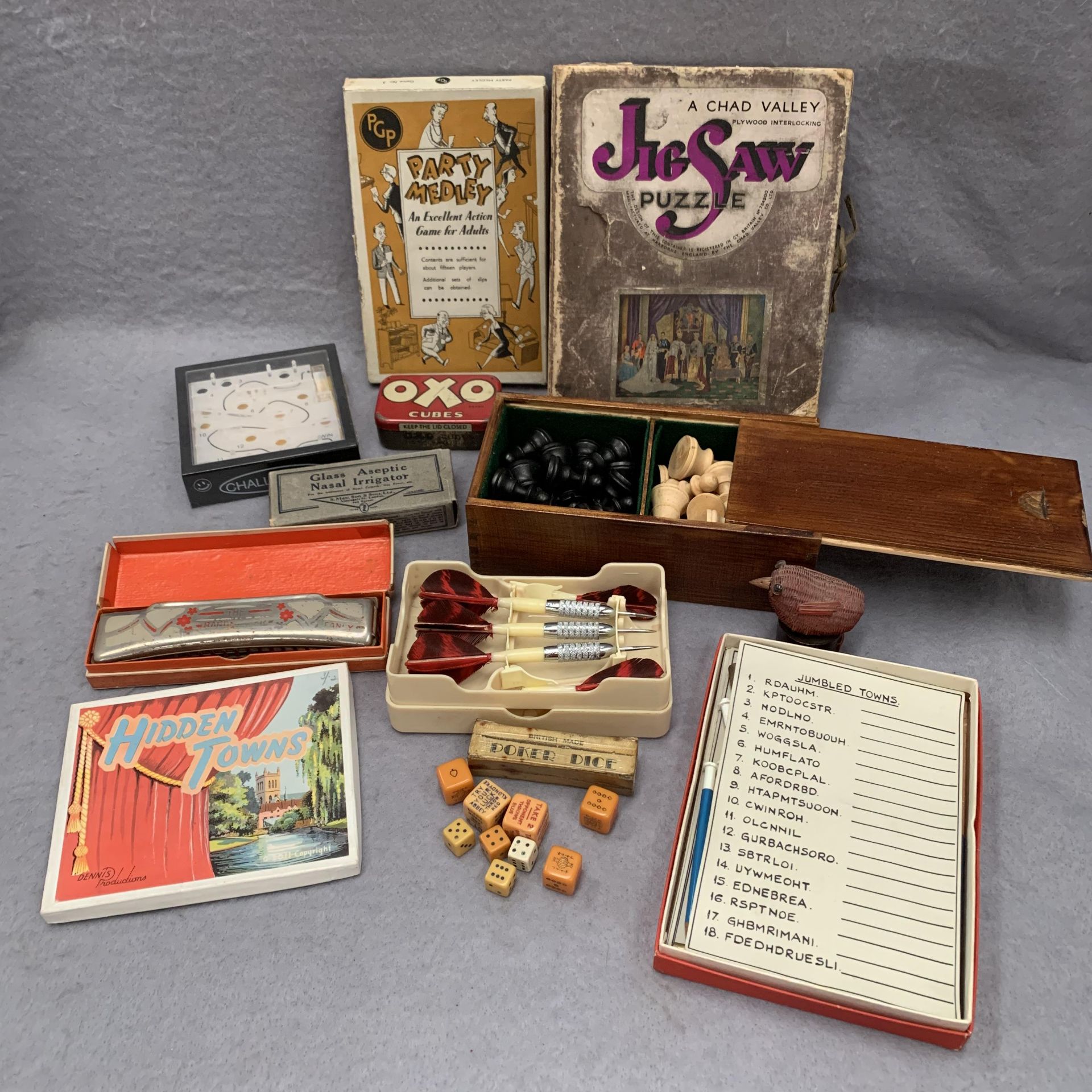 Contents to tray a Chad Valley plywood interlocking jigsaw puzzle, chess set,