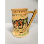 A Widdicombe Fair pottery musical tankard - crack to inner base 16cm high