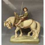 A Royal Dux figure of a boy on a horse, stamped to base 1693, 40cm long,