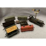 Contents to tray, a Hornby model O gauge clockwork steam train complete with key and tender,