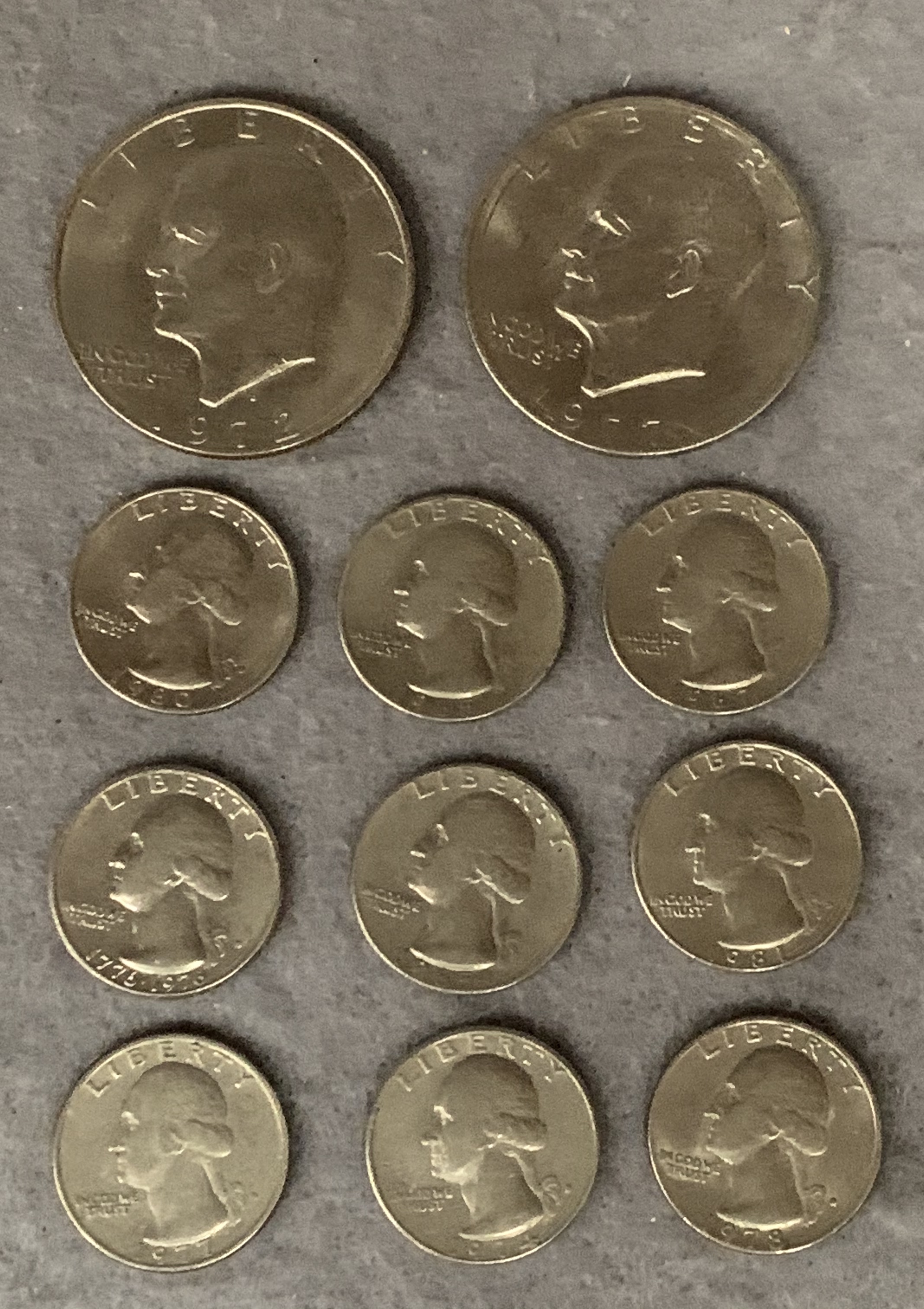 Contents to bag - two American dollars 1972 and 1977, nine American quarter dollars 1960s,