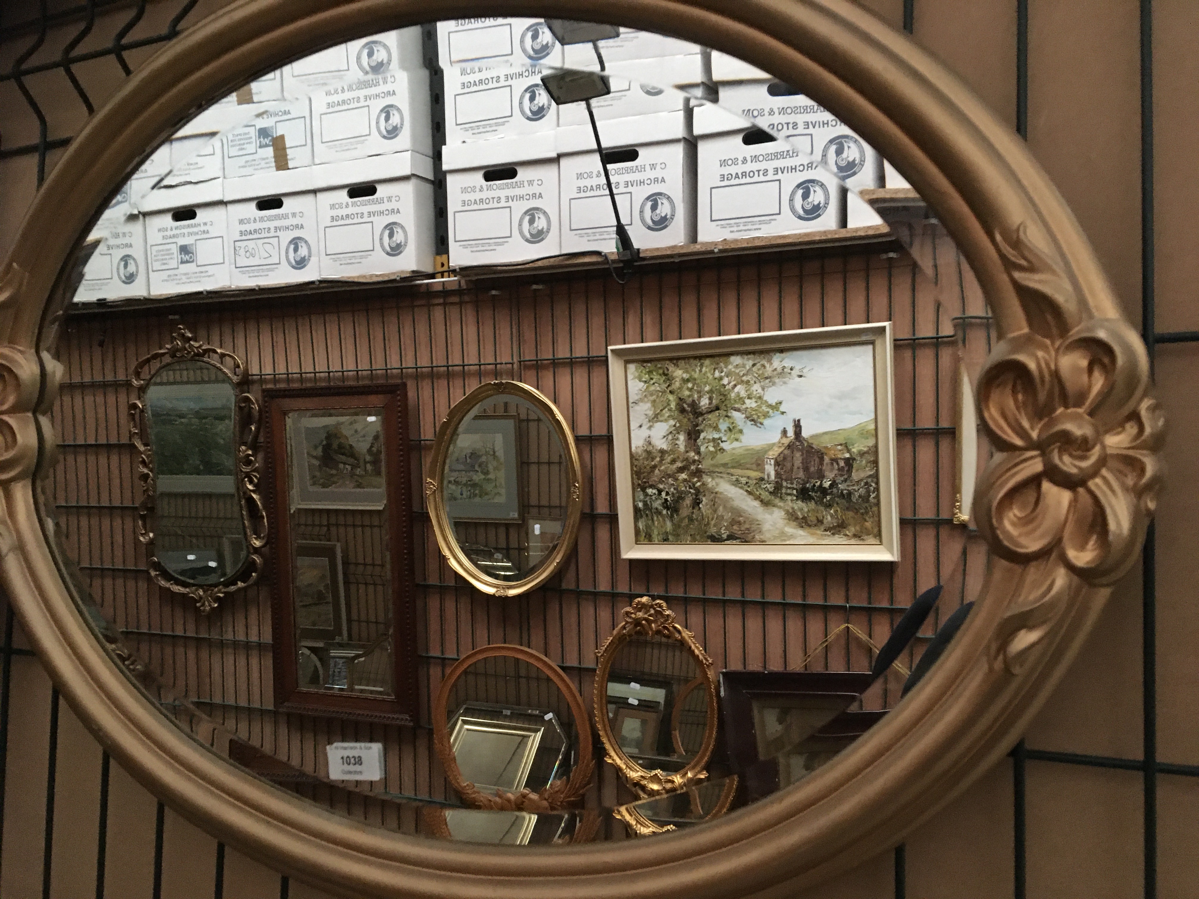 A gilt framed oval wall mirror,