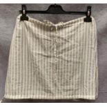 A Crossley ladies short skirt, cream and silver,size XS,