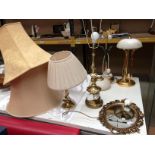 Two brass table lamps, one shade,