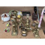 Contents to part of rack, brass candlesticks, brass blow torch, scales,