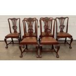 A set of six Victorian mahogany splat back dining chairs with cabriole front legs and claw and ball