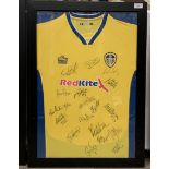 Leeds United Interest: A framed and mounted Admiral Red Kite Leeds United shirt in yellow,