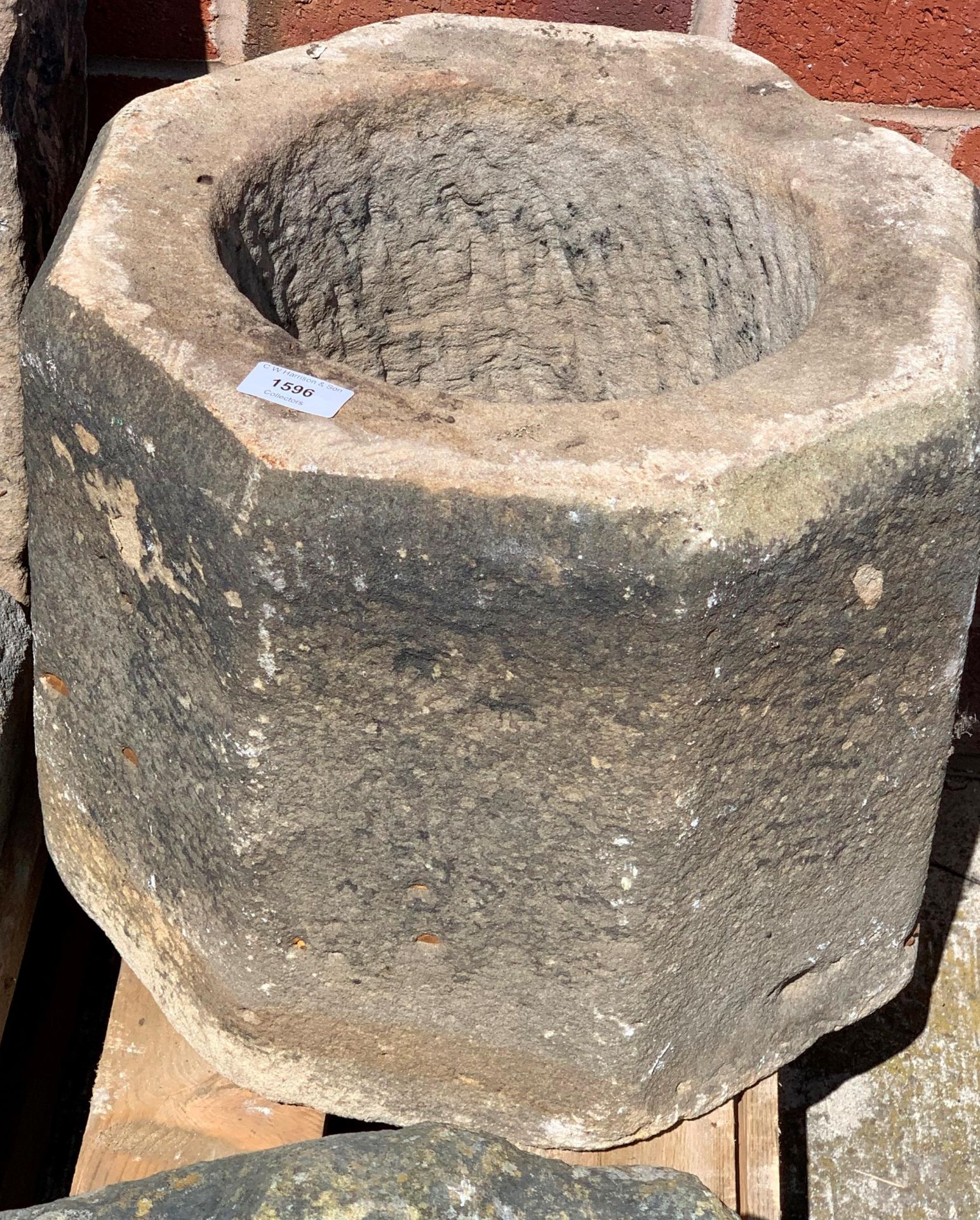 A stone octagonal font style stand, no bottom,