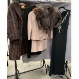 A lady's three-quarter length brown fur coat, no size or trade label, a fur stole,