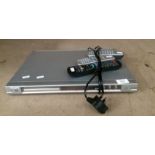 A Phillips DVD7Q8 DVD player complete with two remote controls