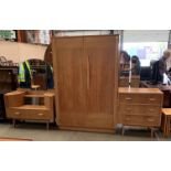 A 1950s oak three piece bedroom suite by Hunt comprising a door door wardrobe, 122cm x 183cm,