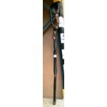 An ebonised African carved walking stick